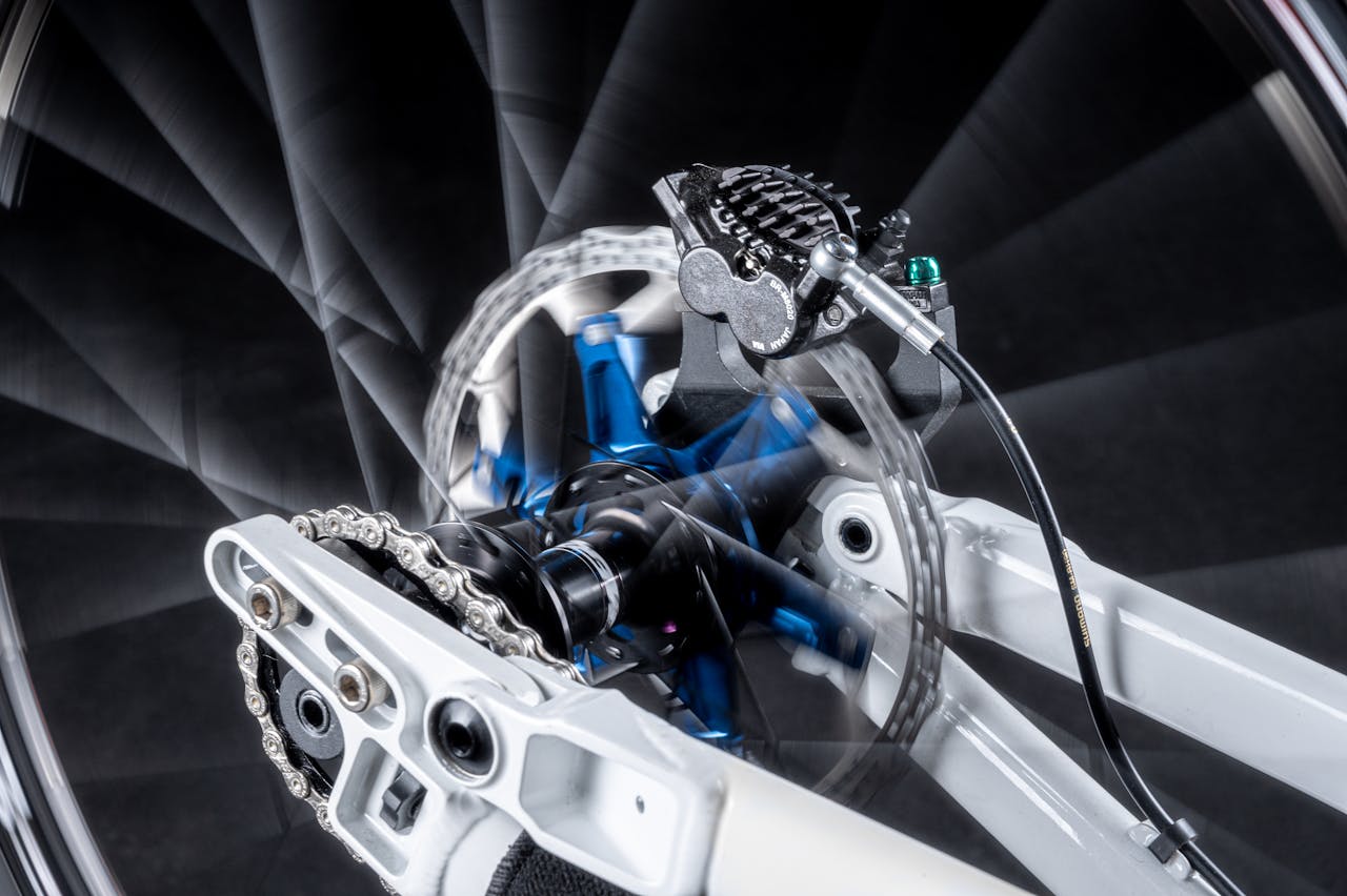 Close-up image showcasing the dynamic movement of a bicycle disk brake system in high detail.